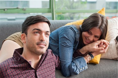 simsearch:649-07118859,k - Young couple lounging on sofa Stock Photo - Premium Royalty-Free, Code: 649-07063149