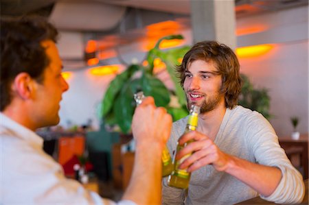 Two men with bottles of beer Stock Photo - Premium Royalty-Free, Code: 649-07063513