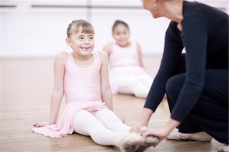 simsearch:649-07063753,k - Teacher adjusting feet position of young ballerina Stock Photo - Premium Royalty-Free, Code: 649-07063694