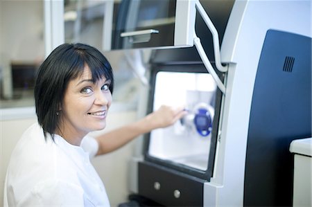 dentistry - Dental technician using equipment to produce denture Stock Photo - Premium Royalty-Free, Code: 649-07063854