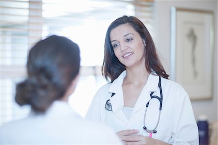 Doctor and nurse chatting Stock Photo - Premium Royalty-Free, Code: 649-07063881