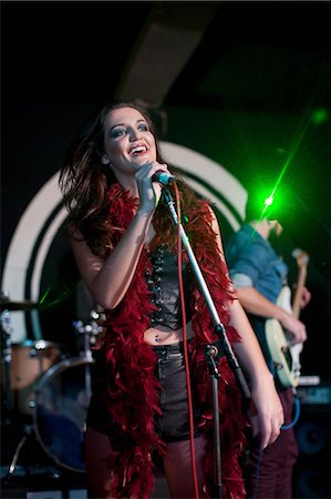 spotlight on stage - Young female singing on stage in club Stock Photo - Premium Royalty-Free, Code: 649-07063895