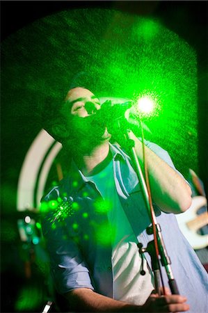 spotlight on stage - Man singing on stage in nightclub Stock Photo - Premium Royalty-Free, Code: 649-07063897