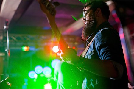 spotlight (beam of light) - Man playing guitar in nightclub Stock Photo - Premium Royalty-Free, Code: 649-07063899