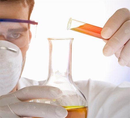 simsearch:6113-07589192,k - Close up of scientist pouring liquid from test tube Stock Photo - Premium Royalty-Free, Code: 649-07118198