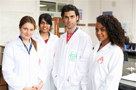 simsearch:649-07118442,k - Portrait of four college students wearing lab coats Stock Photo - Premium Royalty-Free, Code: 649-07118431
