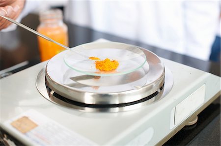 Science student weighing powder Stock Photo - Premium Royalty-Free, Code: 649-07118433