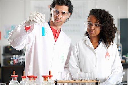 simsearch:649-07118434,k - Two chemistry students doing experiment Stock Photo - Premium Royalty-Free, Code: 649-07118445