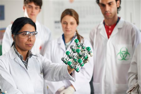simsearch:649-07118442,k - Chemistry teacher and students holding molecular model Stock Photo - Premium Royalty-Free, Code: 649-07118450