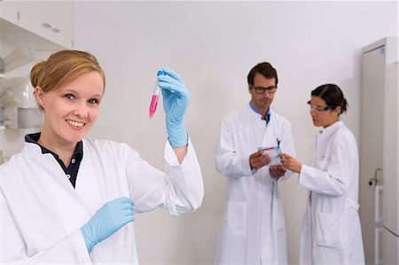 solution (mixture of substances) - Group of scientists at work in laboratory, Cell culture suspension (front), which is later used for western blot technique (back) to see which proteins are pathologically expressed Stock Photo - Premium Royalty-Free, Code: 649-07118826