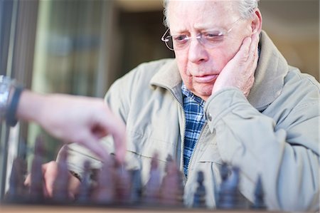 simsearch:614-06897440,k - Senior male playing chess with son Stock Photo - Premium Royalty-Free, Code: 649-07119274