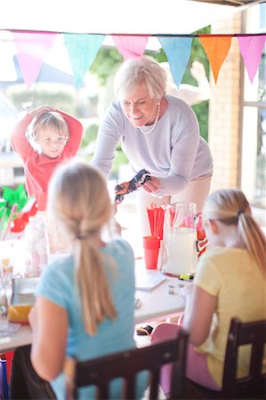 stall - Two young sisters selling to grandma from stall Stock Photo - Premium Royalty-Free, Code: 649-07119288