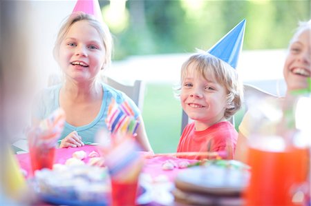 simsearch:649-08180244,k - Brother and his sisters enjoying birthday Stock Photo - Premium Royalty-Free, Code: 649-07119291