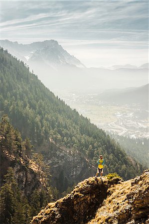 petite ville - Man standing on mountain, Farchant, Bavaria, Germany Photographie de stock - Premium Libres de Droits, Code: 649-07119706