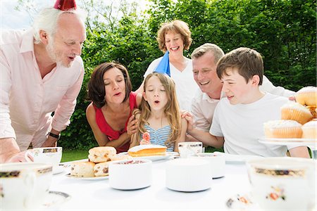 Family celebrating girl's birthday Stock Photo - Premium Royalty-Free, Code: 649-07238648