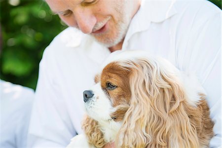 Senior man with pet dog Stock Photo - Premium Royalty-Free, Code: 649-07238640