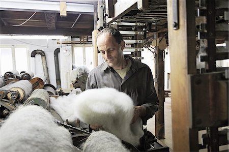 simsearch:649-07238739,k - Worker looking at fleece in wool factory Stock Photo - Premium Royalty-Free, Code: 649-07238739