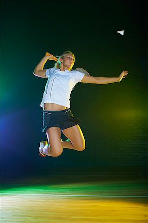 simsearch:649-07239531,k - Young female badminton player mid air on court Stock Photo - Premium Royalty-Free, Code: 649-07238932