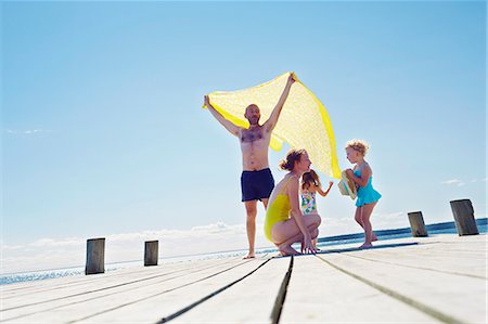 european bathing suits men - Young family on pier, Utvalnas, Gavle, Sweden Stock Photo - Premium Royalty-Free, Code: 649-07239014