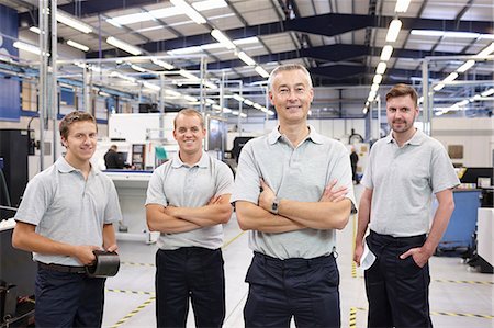 people working in factory - Portrait of manager and workers in engineering factory Stock Photo - Premium Royalty-Free, Code: 649-07239344