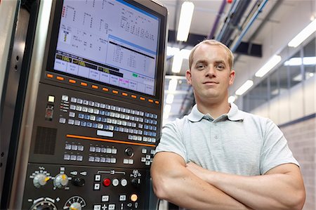 simsearch:649-07239373,k - Portrait of engineer and control panel in engineering factory Stock Photo - Premium Royalty-Free, Code: 649-07239363