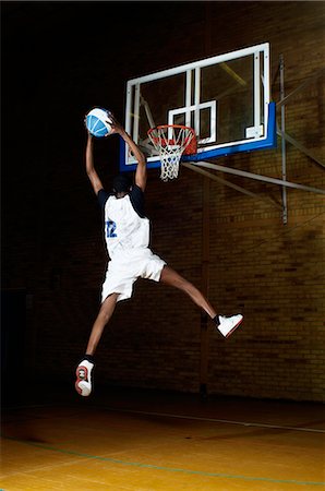 simsearch:649-07239531,k - Basketball player jumping with ball Stock Photo - Premium Royalty-Free, Code: 649-07239501