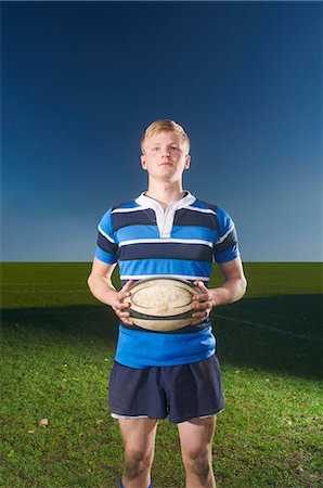 simsearch:649-07239531,k - Portrait of young man holding rugby ball Stock Photo - Premium Royalty-Free, Code: 649-07239530