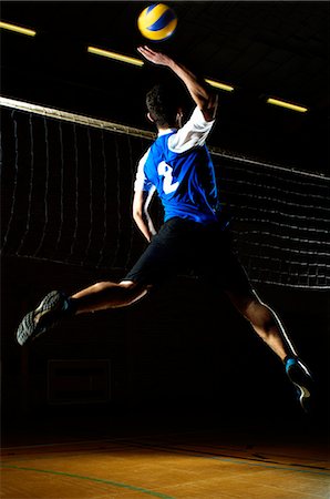 simsearch:649-07239531,k - Volleyball player jumping for ball by net Stock Photo - Premium Royalty-Free, Code: 649-07239545