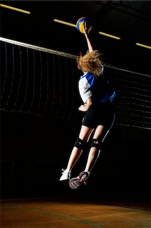 simsearch:649-07239531,k - Volleyball player jumping for ball by net Stock Photo - Premium Royalty-Free, Code: 649-07239546