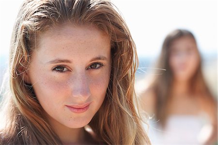simsearch:649-07239584,k - Portrait of teenage girl, focus on foreground Stock Photo - Premium Royalty-Free, Code: 649-07239565