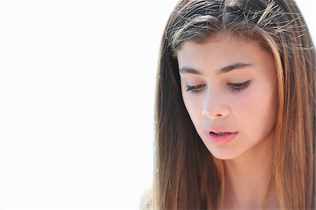 simsearch:649-07239584,k - Portrait of brunette teenage girl looking down Stock Photo - Premium Royalty-Free, Code: 649-07239574