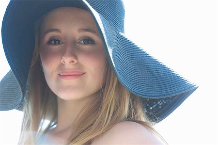simsearch:649-07239584,k - Portrait of teenage girl wearing blue sunhat Stock Photo - Premium Royalty-Free, Code: 649-07239584