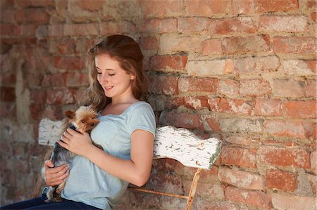 simsearch:649-07239584,k - Teenage girl on bench with dog, smiling Stock Photo - Premium Royalty-Free, Code: 649-07239598