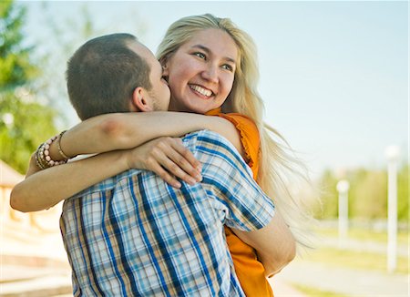 simsearch:649-07560084,k - Happy young couple embracing Stock Photo - Premium Royalty-Free, Code: 649-07239879