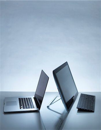 Laptop and PC on desk Stock Photo - Premium Royalty-Free, Code: 649-07279558