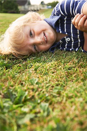 Young boy playing in garden Stock Photo - Premium Royalty-Free, Code: 649-07279614