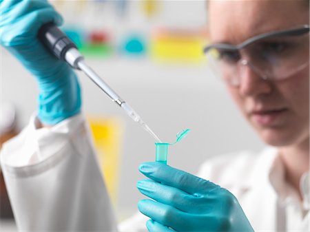 deoxyribonucleic acid - Laboratory worker pipetting sample into an eppendorf vial Stock Photo - Premium Royalty-Free, Code: 649-07279836
