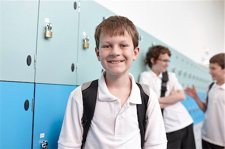 Portrait of schoolboy in corridor Stock Photo - Premium Royalty-Free, Code: 649-07280045