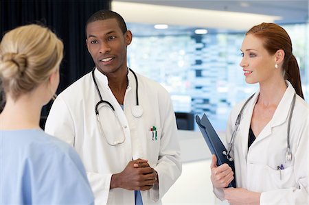 Doctors and nurse having conversation Stock Photo - Premium Royalty-Free, Code: 649-07280656