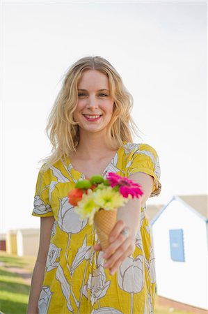 fashion floral patterns - Portrait of young woman with flower cone, Whitstable, Kent, UK Stock Photo - Premium Royalty-Free, Code: 649-07280789