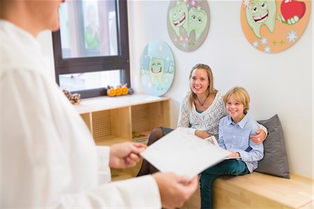 dentist - Mother and son in dentists waiting room Stock Photo - Premium Royalty-Free, Code: 649-07280844