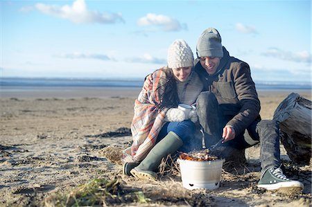 Young couple having bbq on beach, Brean Sands, Somerset, England Stock Photo - Premium Royalty-Free, Code: 649-07281047