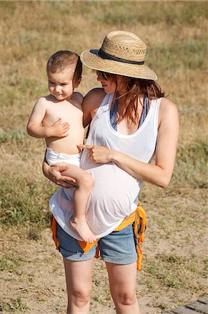 diapered - Mother holding son in arms Stock Photo - Premium Royalty-Free, Code: 649-07436381