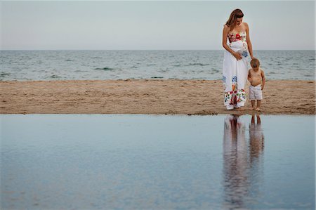 simsearch:649-07436413,k - Mother and toddler looking down at reflections Stock Photo - Premium Royalty-Free, Code: 649-07436412