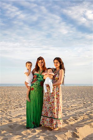 simsearch:649-07436413,k - Mothers standing on beach holding baby and toddler Stock Photo - Premium Royalty-Free, Code: 649-07436432