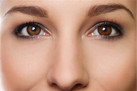 eyebrows - Cropped studio portrait of young woman's eyes Stock Photo - Premium Royalty-Free, Code: 649-07436632