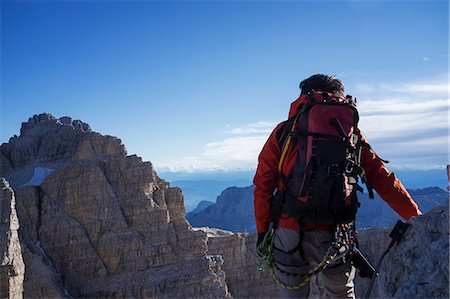 Climber in Brenta Dolomites, Italy, preparing for climb Stock Photo - Premium Royalty-Free, Code: 649-07436735