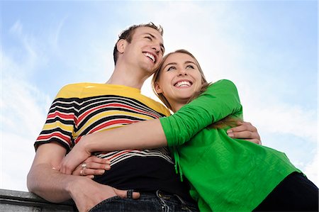 Portrait of couple with arms around each other smiling Stock Photo - Premium Royalty-Free, Code: 649-07436935