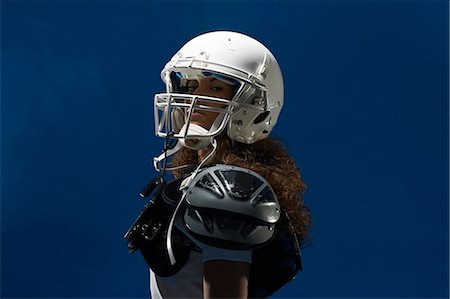 Portrait of female american footballer wearing helmet Photographie de stock - Premium Libres de Droits, Code: 649-07437156