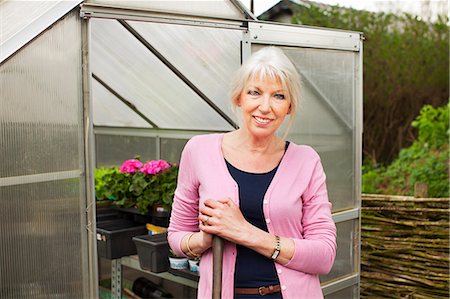 Portrait of mature woman by greenhouse Stock Photo - Premium Royalty-Free, Code: 649-07437918